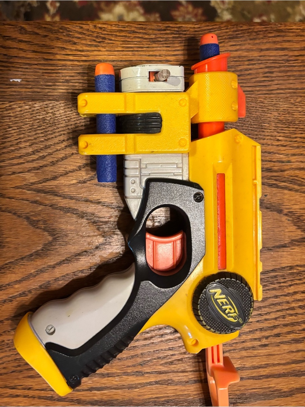 Nerf Yellow and Orange Foam Dart Pistol with Black and Gray Grip